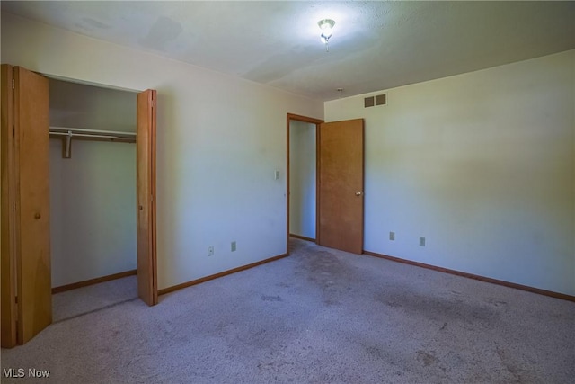 265 Franklin Dr, Doylestown, OH 44230 - unfurnished bedroom featuring carpet flooring, baseboards, and a closet