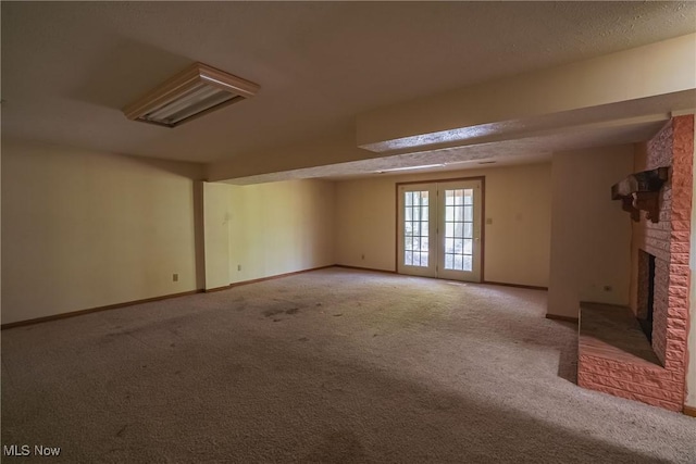 265 Franklin Dr, Doylestown, OH 44230 - basement featuring light colored carpet, a brick fireplace, and baseboards