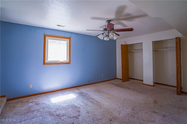 265 Franklin Dr, Doylestown, OH 44230 - unfurnished bedroom with carpet flooring, two closets, baseboards, and a ceiling fan