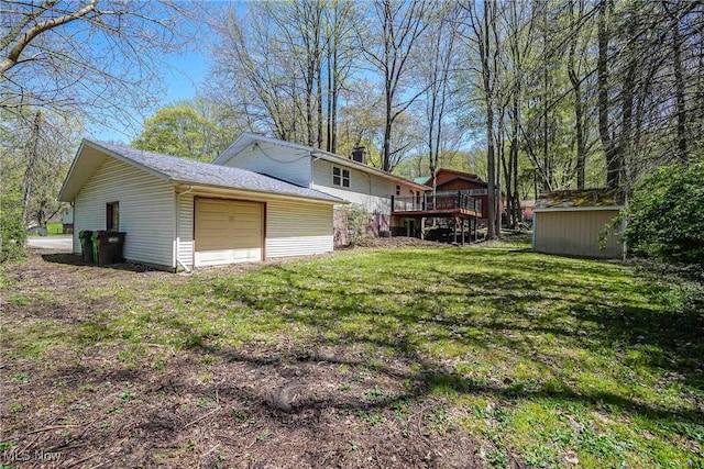 265 Franklin Dr, Doylestown, OH 44230 - view of grassy yard with an outbuilding, a deck, and a storage unit