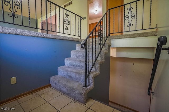 265 Franklin Dr, Doylestown, OH 44230 - staircase featuring tile patterned flooring and baseboards