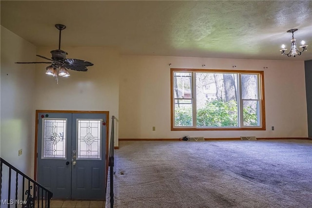 265 Franklin Dr, Doylestown, OH 44230 - foyer entrance with carpet flooring, baseboards, a chandelier, ceiling fan, and a textured ceiling