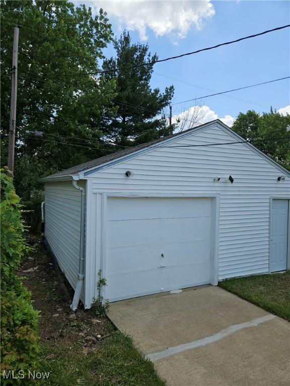 5897 Kimberly Dr, Bedford Heights, OH 44146 - detached garage featuring concrete driveway