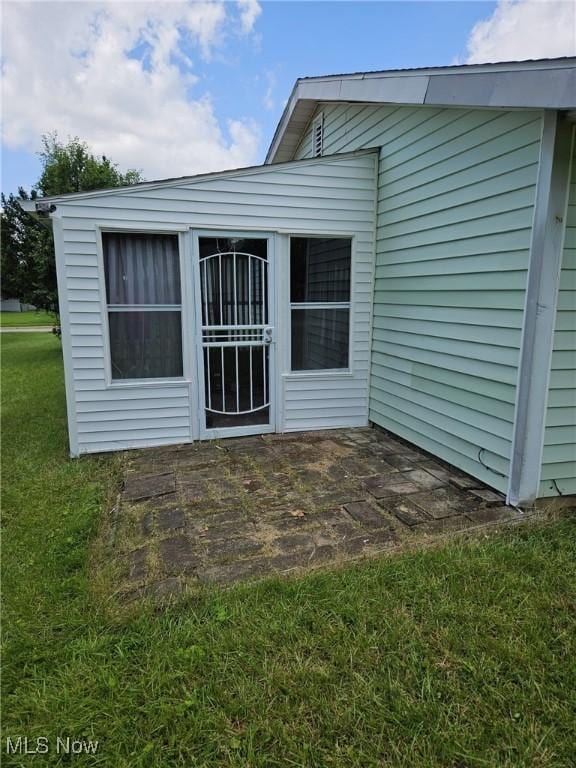 5897 Kimberly Dr, Bedford Heights, OH 44146 - rear view of property featuring a lawn
