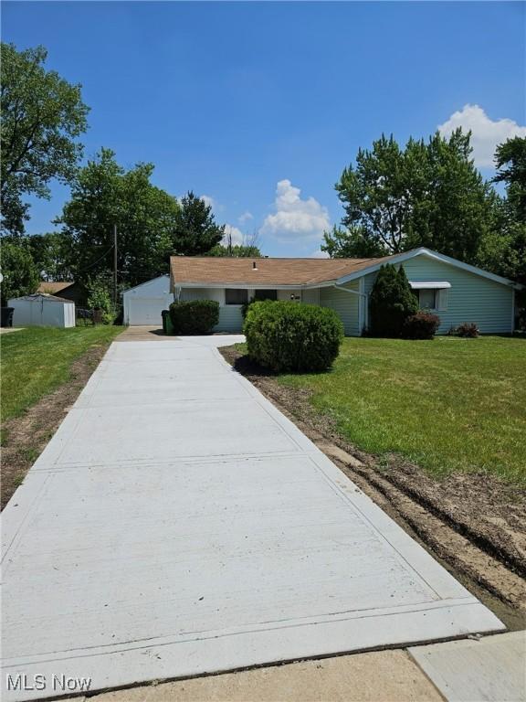 5897 Kimberly Dr, Bedford Heights, OH 44146 - single story home with a front lawn and a garage