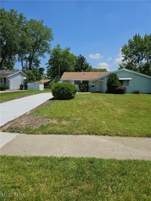 5897 Kimberly Dr, Bedford Heights, OH 44146 - view of front facade with concrete driveway and a front lawn