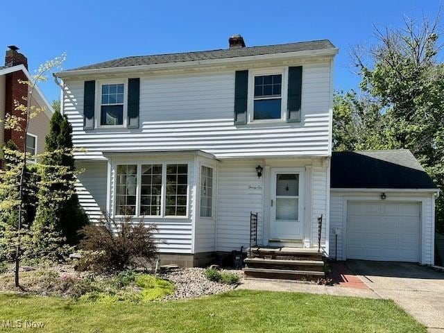 36 Levan Dr, Painesville, OH 44077 - colonial house with entry steps, an attached garage, driveway, and a chimney