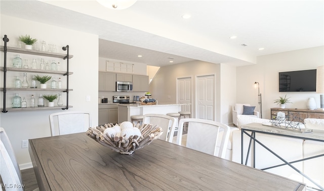 420 Honeycrisp Dr NE, Louisville, OH 44641 - dining area featuring recessed lighting, baseboards, and wood finished floors