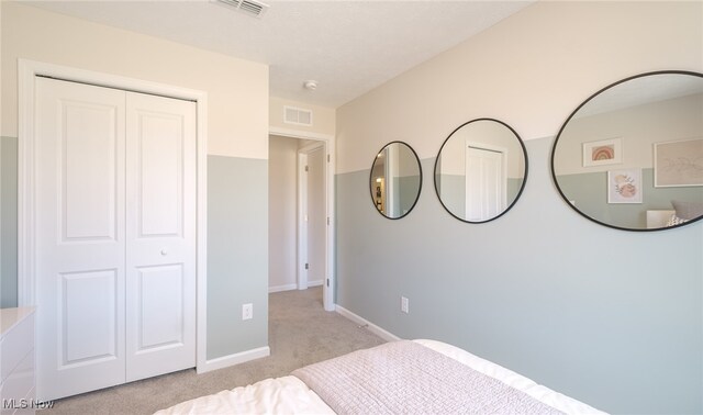 420 Honeycrisp Dr NE, Louisville, OH 44641 - bedroom featuring light carpet, a closet, and baseboards