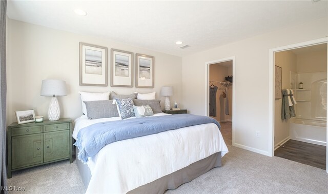 420 Honeycrisp Dr NE, Louisville, OH 44641 - carpeted bedroom featuring a spacious closet, a closet, baseboards, recessed lighting, and connected bathroom