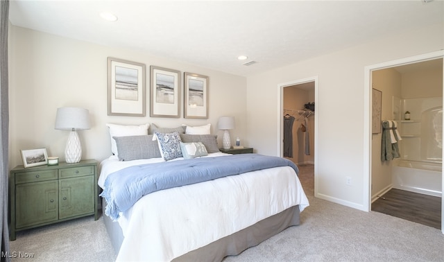424 Honeycrisp Dr NE, Louisville, OH 44641 - bedroom featuring a walk in closet, carpet floors, a closet, baseboards, and recessed lighting