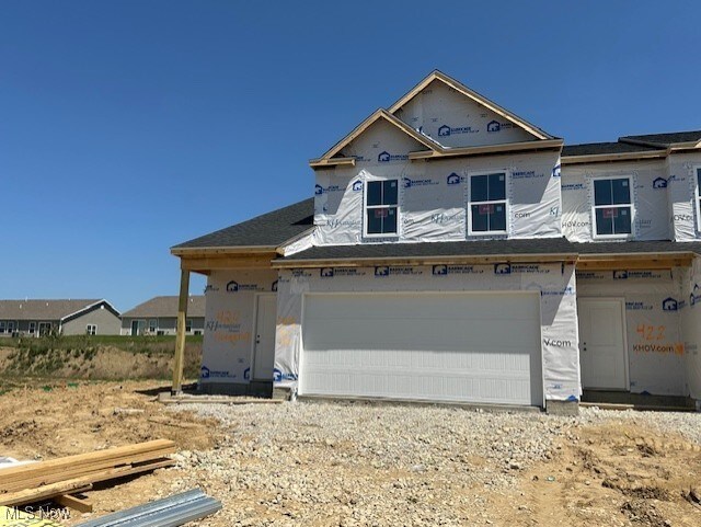 424 Honeycrisp Dr NE, Louisville, OH 44641 - property in mid-construction with a garage