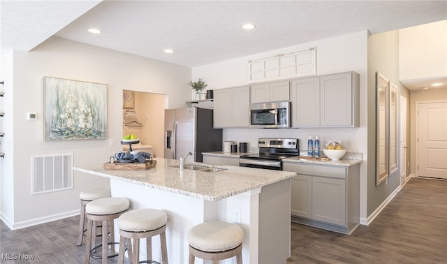 424 Honeycrisp Dr NE, Louisville, OH 44641 - kitchen with appliances with stainless steel finishes, a sink, gray cabinetry, dark wood-style flooring, and recessed lighting
