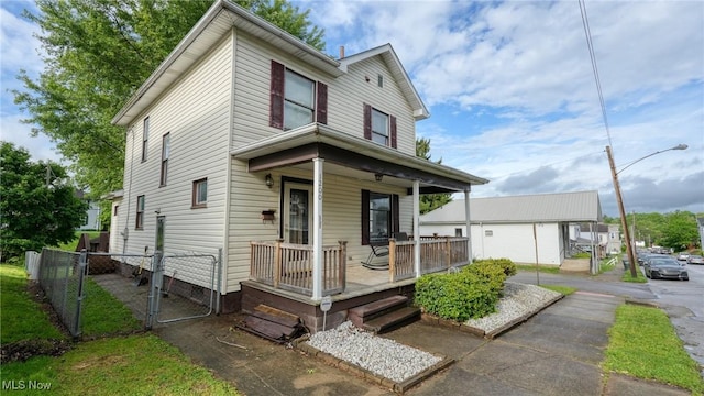 1200 Blaine Ave, Cambridge, OH 43725 - view of front of house with a porch, a gate, and fence