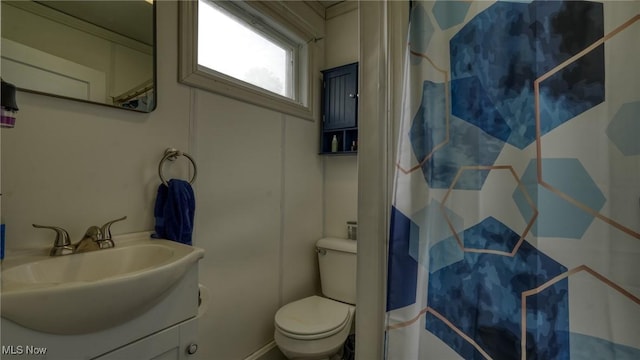1200 Blaine Ave, Cambridge, OH 43725 - bathroom with toilet, curtained shower, and vanity