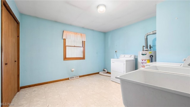 7116 Norwalk Rd, Medina, OH 44256 - laundry area featuring water heater, washer and clothes dryer, baseboards, and light flooring