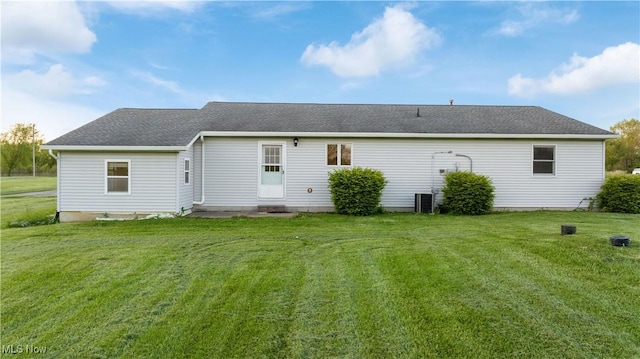 7116 Norwalk Rd, Medina, OH 44256 - rear view of property featuring a yard, entry steps, and roof with shingles