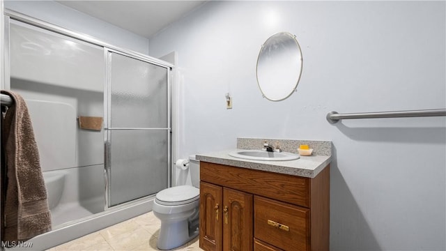 7116 Norwalk Rd, Medina, OH 44256 - bathroom with a shower stall, vanity, toilet, and tile patterned floors