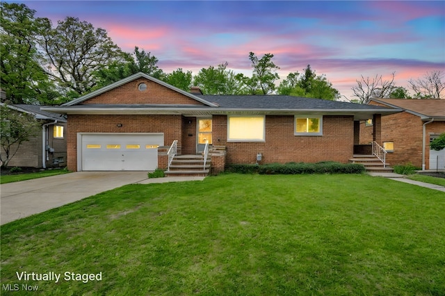 4422 Forest Hills Blvd, Parma, OH 44134 - ranch-style house with brick siding, driveway, an attached garage, and a yard