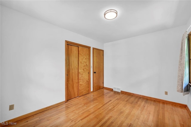 4422 Forest Hills Blvd, Parma, OH 44134 - unfurnished bedroom with baseboards and light wood-style flooring