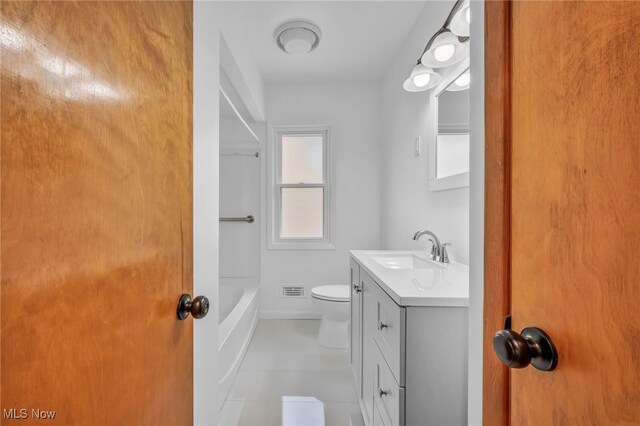 4422 Forest Hills Blvd, Parma, OH 44134 - full bathroom with vanity, toilet, and tile patterned flooring
