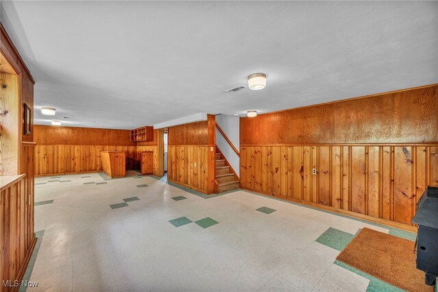 4422 Forest Hills Blvd, Parma, OH 44134 - finished basement with wooden walls, stairway, and tile patterned floors