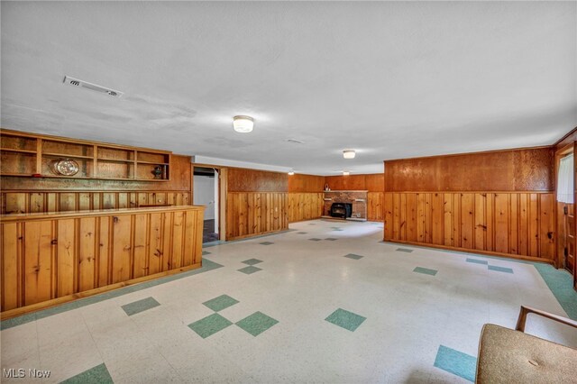 4422 Forest Hills Blvd, Parma, OH 44134 - basement with wood walls, light flooring, and baseboards