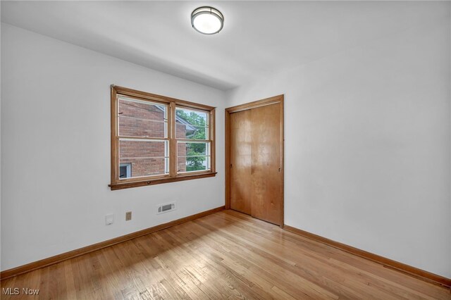 4422 Forest Hills Blvd, Parma, OH 44134 - unfurnished room featuring baseboards and light wood-type flooring