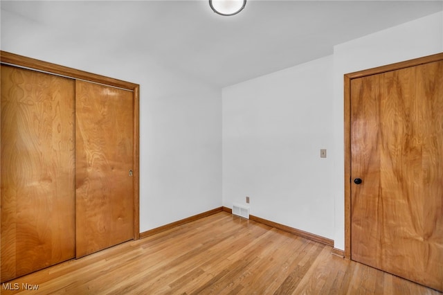4422 Forest Hills Blvd, Parma, OH 44134 - unfurnished bedroom with light wood-style floors and baseboards