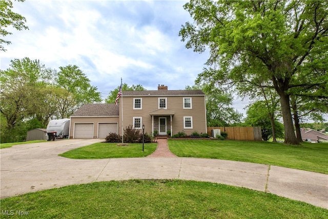 13658 Market Ave N, Hartville, OH 44632 - colonial home featuring an attached garage, driveway, and a chimney