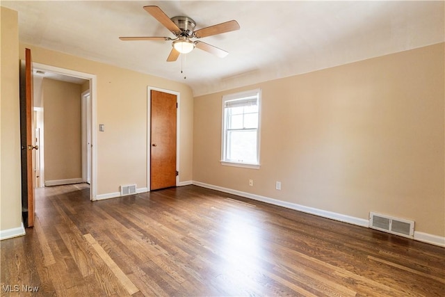 unfurnished bedroom with wood finished floors, baseboards, and ceiling fan