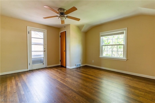 unfurnished room with plenty of natural light, dark wood-style floors, and baseboards