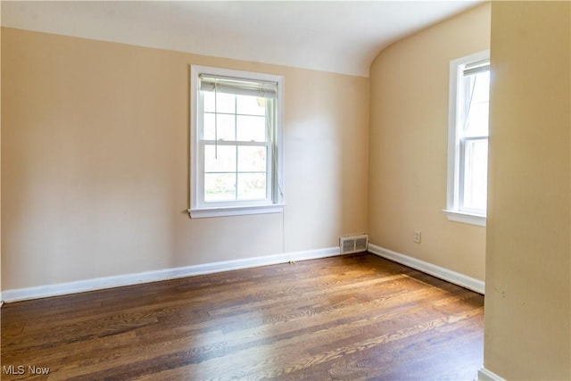 unfurnished room featuring wood finished floors and baseboards