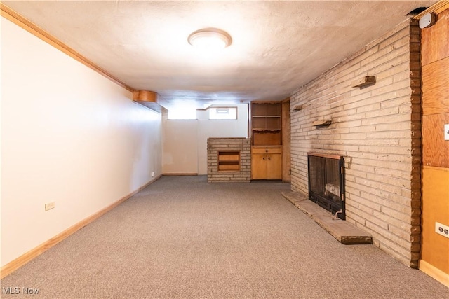below grade area with a fireplace, carpet flooring, and baseboards