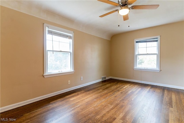 spare room with wood finished floors, baseboards, and ceiling fan