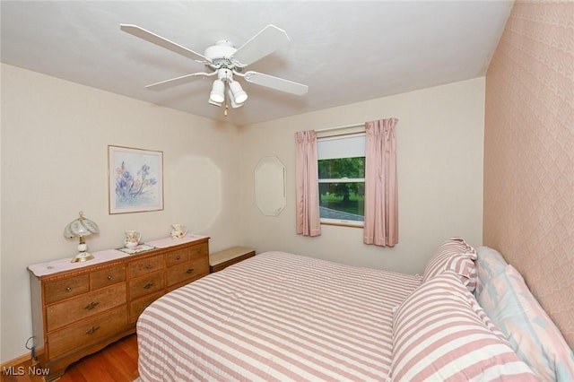 1883 Massillon Rd, Akron, OH 44312 - bedroom with wood finished floors and a ceiling fan