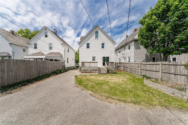 1303 W 115th St, Cleveland, OH 44102 - rear view of property with a deck