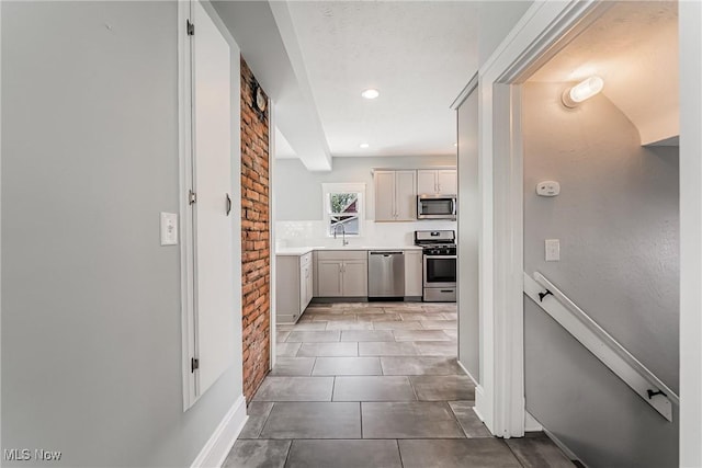 1303 W 115th St, Cleveland, OH 44102 - hall featuring light tile patterned floors, baseboards, recessed lighting, and a sink
