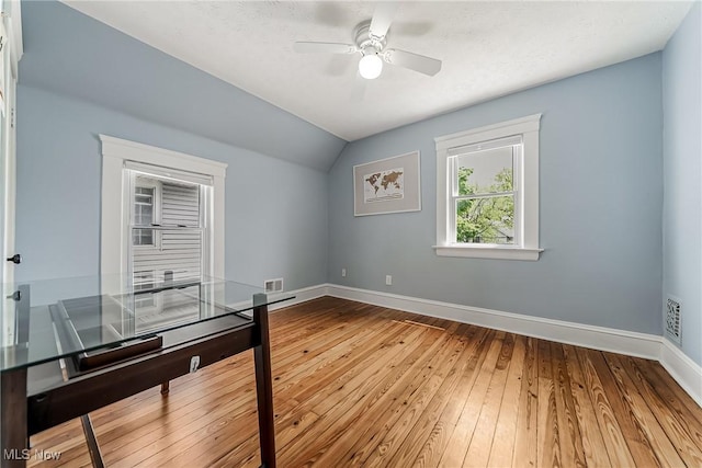 1303 W 115th St, Cleveland, OH 44102 - unfurnished office featuring baseboards, wood-type flooring, vaulted ceiling, and a ceiling fan