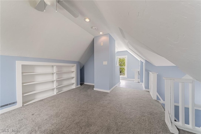 1303 W 115th St, Cleveland, OH 44102 - bonus room featuring built in features, carpet flooring, lofted ceiling, recessed lighting, and baseboards