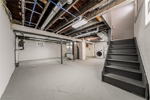 1303 W 115th St, Cleveland, OH 44102 - unfinished below grade area with washer / dryer, stairs, heating unit, and gas meter