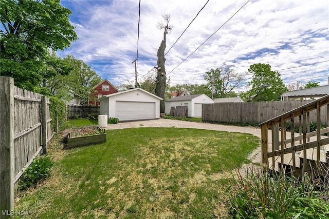 1303 W 115th St, Cleveland, OH 44102 - view of yard with a garage, an outbuilding, and a garden