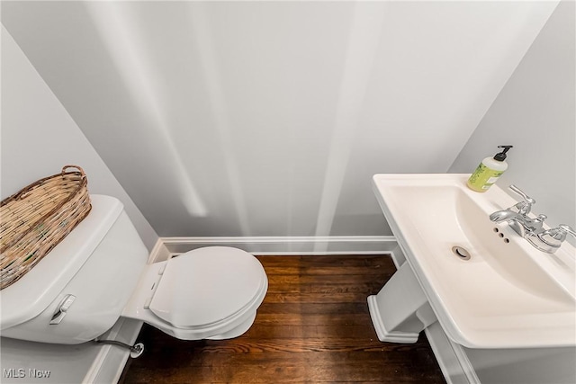 1303 W 115th St, Cleveland, OH 44102 - bathroom featuring hardwood / wood-style flooring, toilet, and baseboards