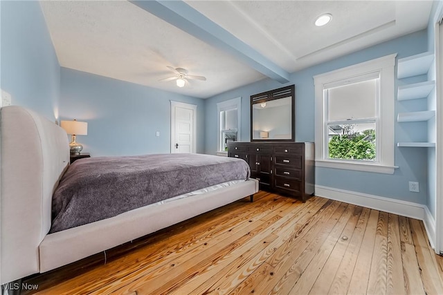 1303 W 115th St, Cleveland, OH 44102 - bedroom featuring baseboards, hardwood / wood-style flooring, beamed ceiling, and ceiling fan