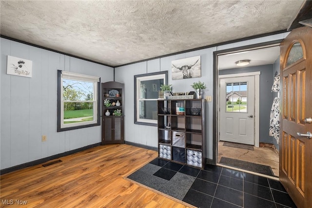 1439 Township Road 593, Ashland, OH 44805 - entrance foyer featuring plenty of natural light, a textured ceiling, baseboards, and wood finished floors
