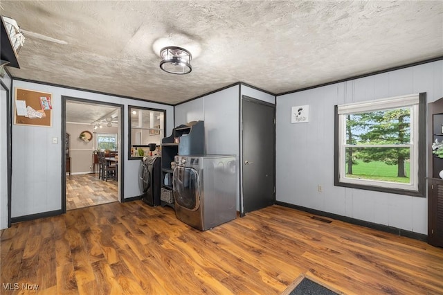1439 Township Road 593, Ashland, OH 44805 - interior space with wood finished floors, a textured ceiling, baseboards, and washing machine and clothes dryer