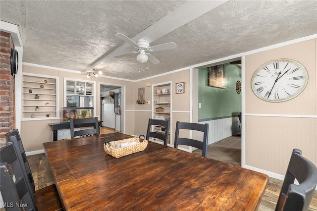 1439 Township Road 593, Ashland, OH 44805 - dining space with a textured ceiling, built in features, a ceiling fan, ornamental molding, and wainscoting