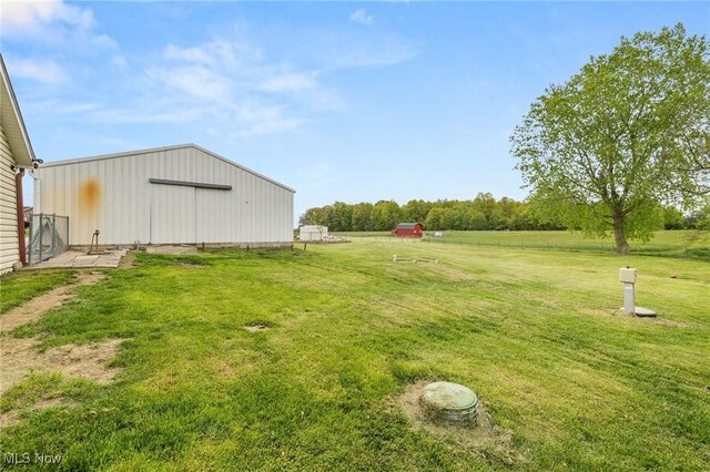1439 Township Road 593, Ashland, OH 44805 - view of green lawn featuring an outbuilding, an outdoor structure, and a detached garage
