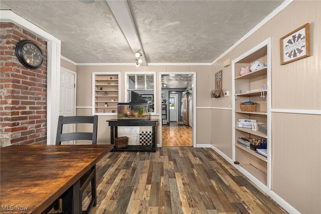 1439 Township Road 593, Ashland, OH 44805 - dining space with built in shelves, wood-type flooring, a textured ceiling, baseboards, and ornamental molding