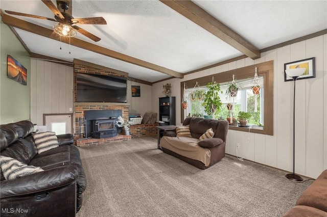 1439 Township Road 593, Ashland, OH 44805 - carpeted living room featuring a wood stove and a ceiling fan